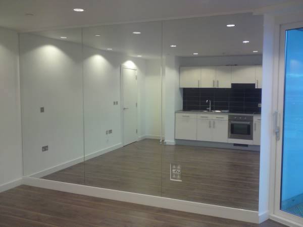 E.A. Glass custom mirror installation: Full-Wall Residential Mirror